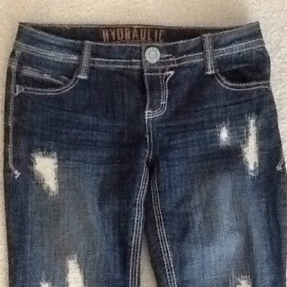 Slightly  ripped blue jeans , skin not exposed